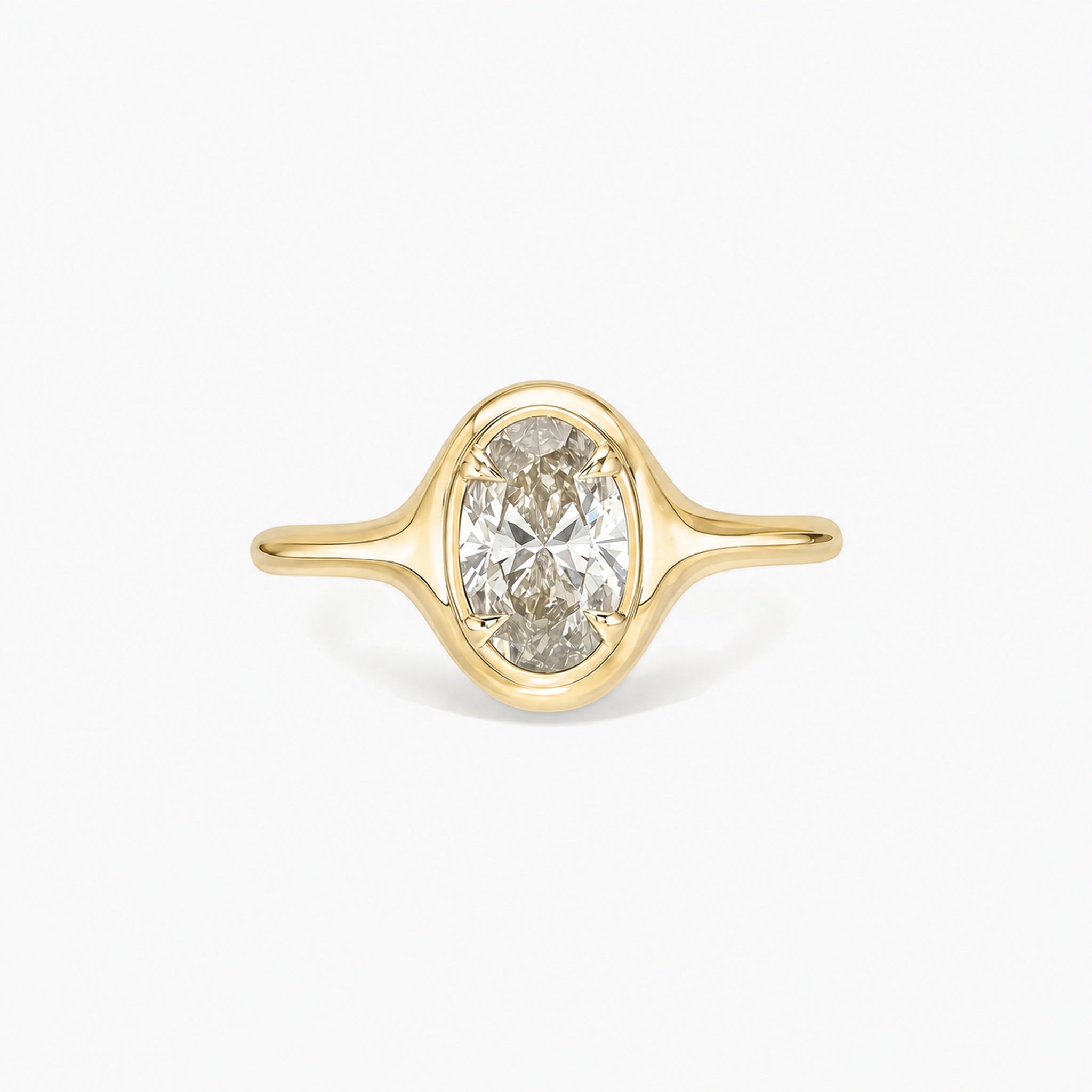 1.5 ct Oval-Cut Moissanite Bezel-Prong Ring in yellow gold vermeil, front view.