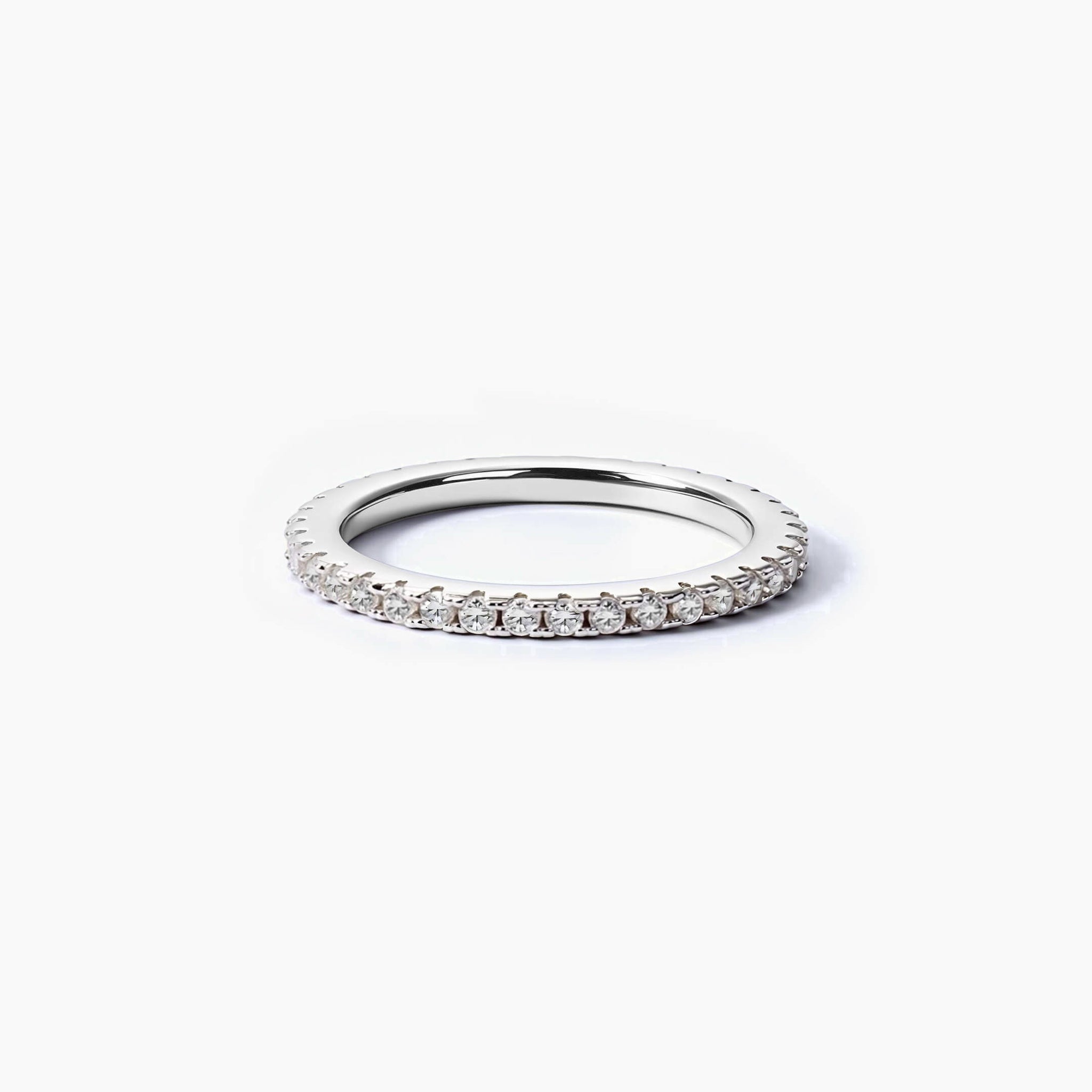 1.5 mm slim moissanite eternity ring in white gold vermeil, angled view.