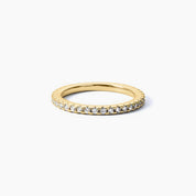 1.5 mm slim moissanite eternity ring in yellow gold vermeil, angled view.