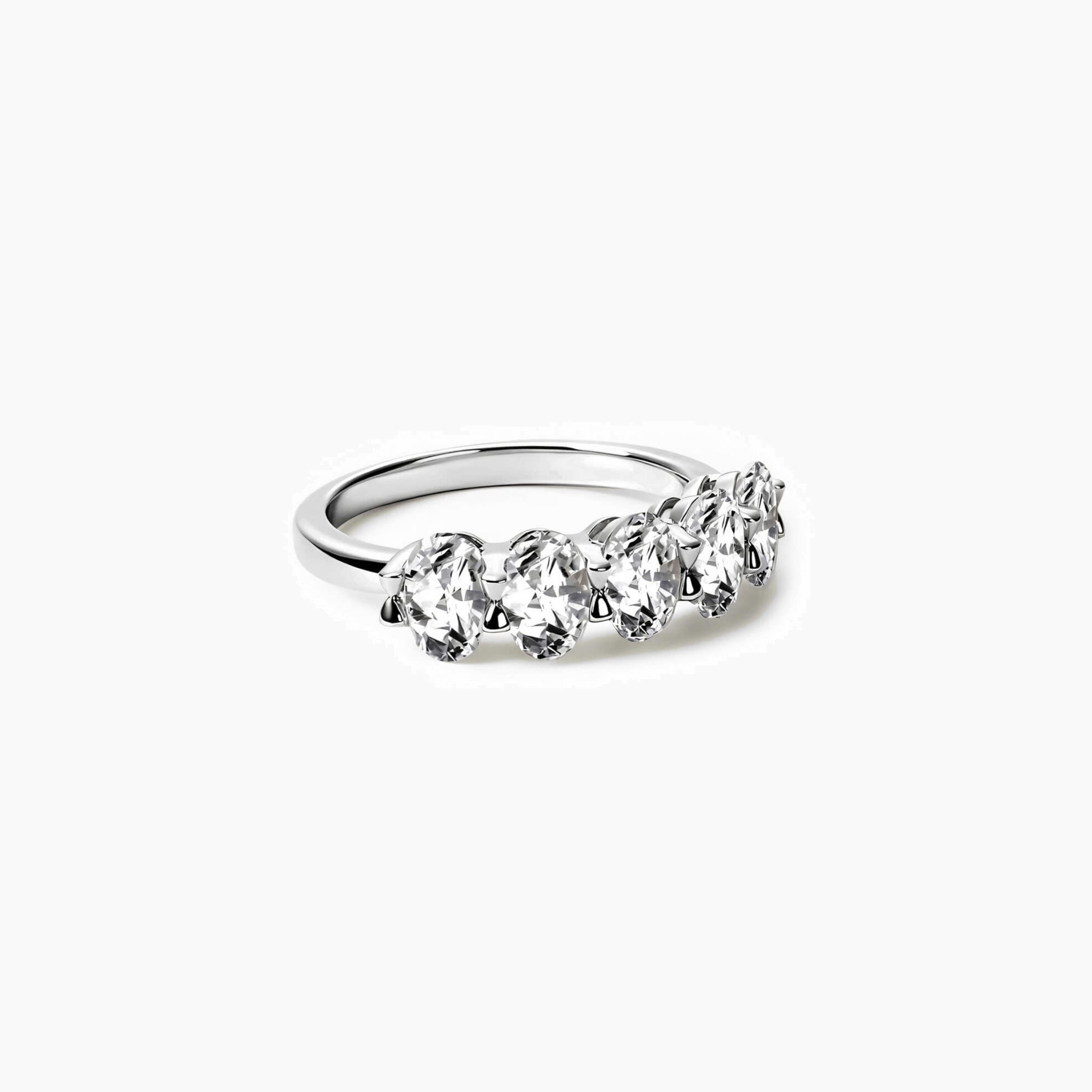 2.5 ct oval-cut moissanite half eternity ring in white gold vermeil, angled view.