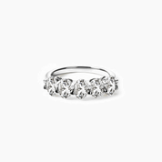 2.5 ct oval-cut moissanite half eternity ring in white gold vermeil, front view.