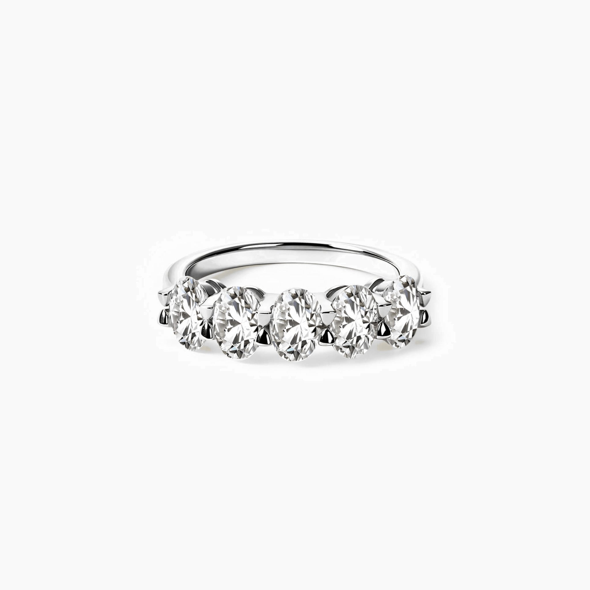 2.5 ct oval-cut moissanite half eternity ring in white gold vermeil, front view.