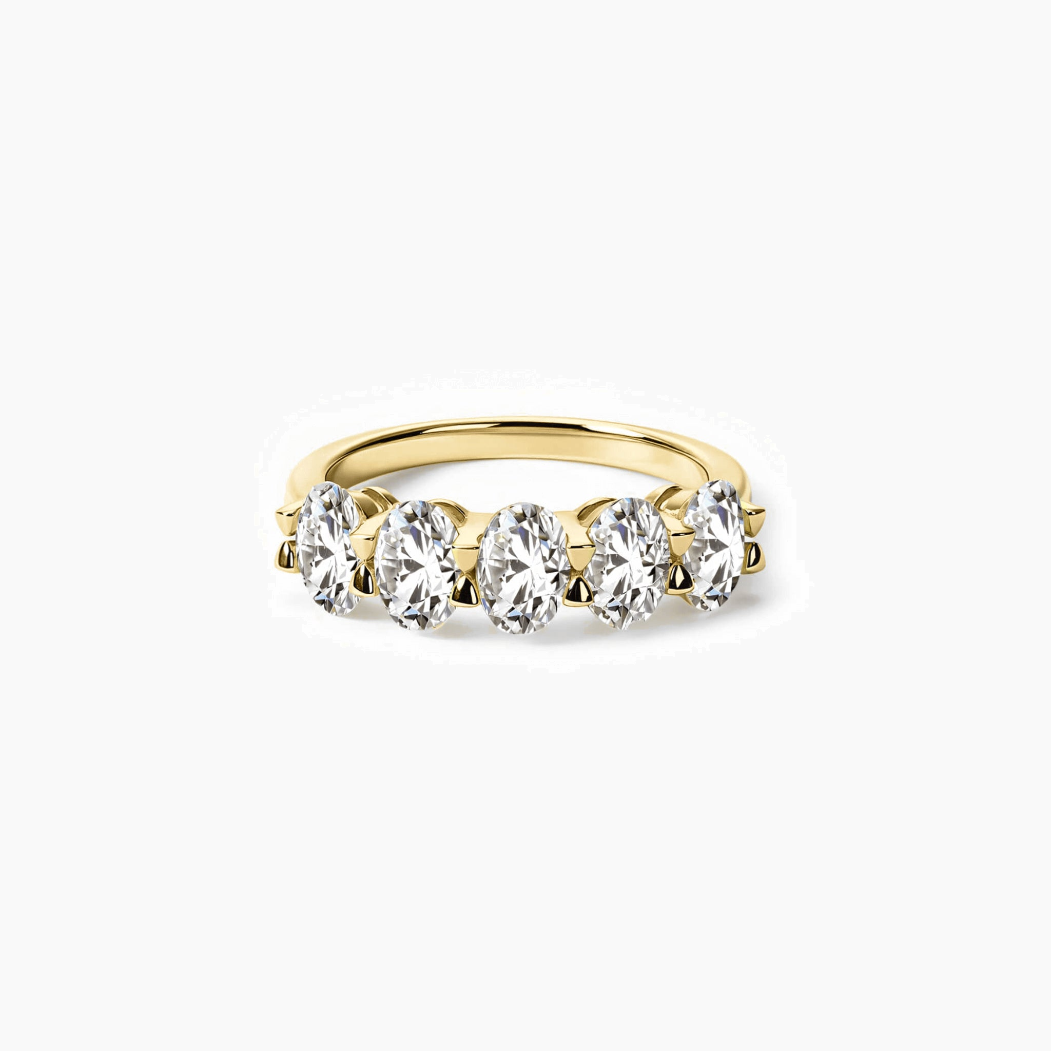 2.5 ct oval-cut moissanite half eternity ring in yellow gold vermeil, front view.