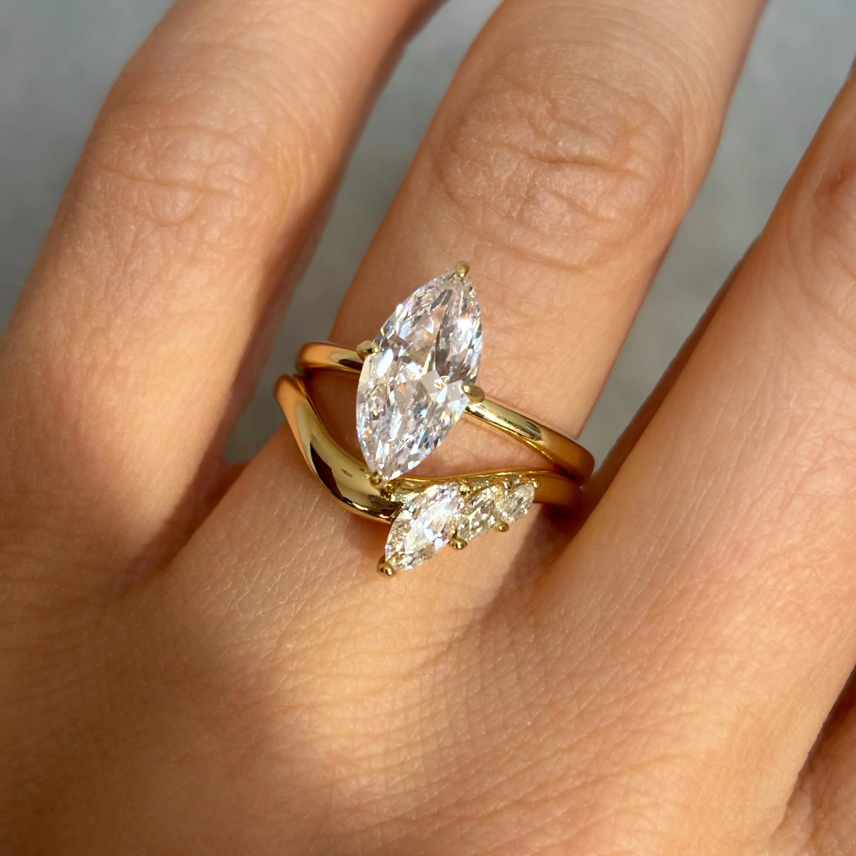 2 ct marquise-cut moissanite solitaire ring worn on a finger.