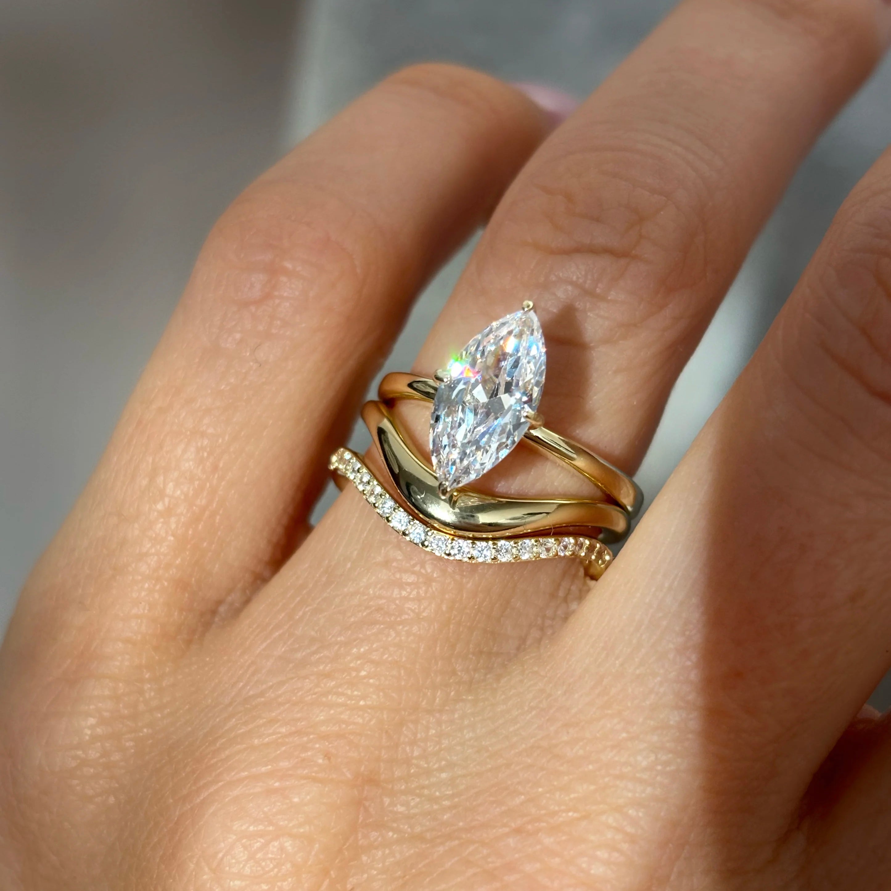 2 ct marquise-cut moissanite solitaire ring worn on a finger.