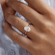 2 ct oval-cut moissanite solitaire ring worn on a finger.
