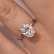 2 ct oval-cut moissanite solitaire ring worn on a finger.