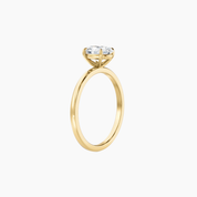 2 ct oval-cut moissanite solitaire ring in yellow gold vermeil, side view.