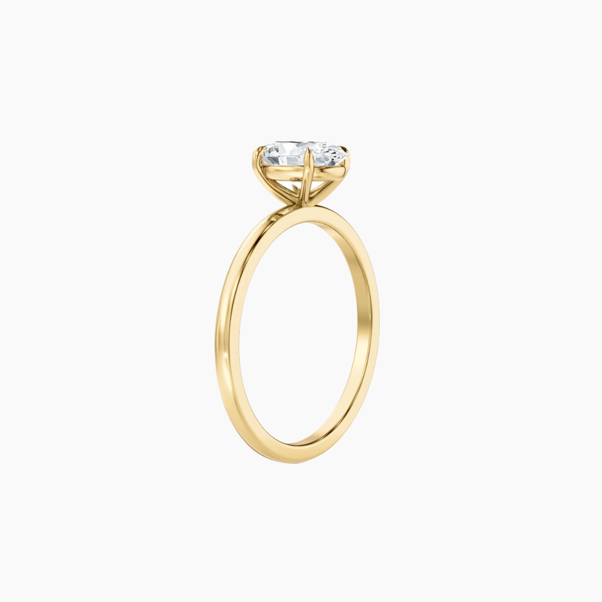 2 ct oval-cut moissanite solitaire ring in yellow gold vermeil, side view.