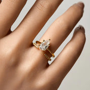 2 ct pear-cut moissanite solitaire ring worn on a finger.