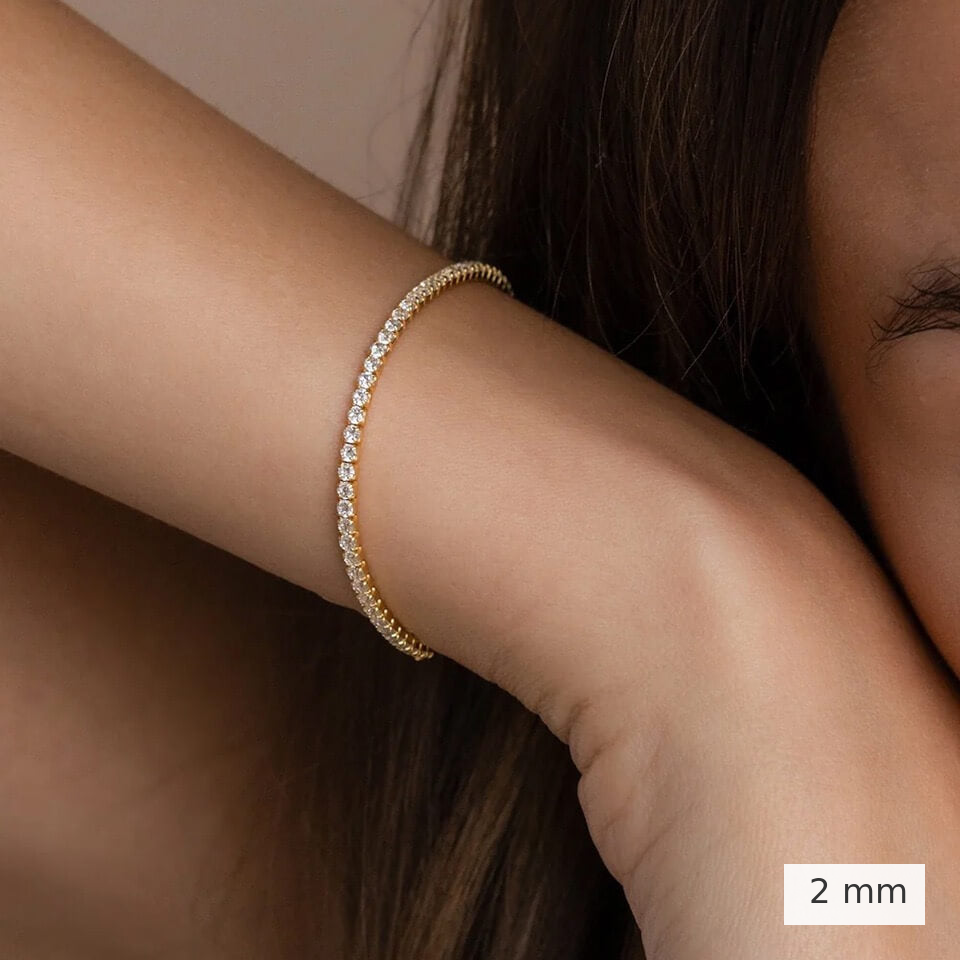 2 mm lab-grown diamond tennis bracelet worn on the wrist.