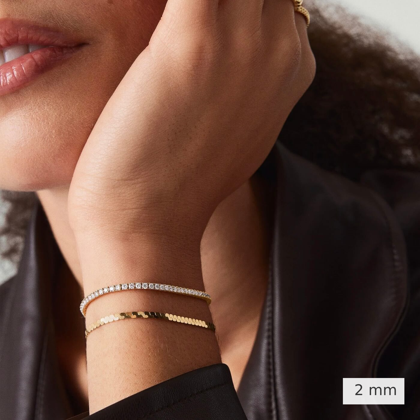 2 mm lab-grown diamond tennis bracelet worn on the wrist.