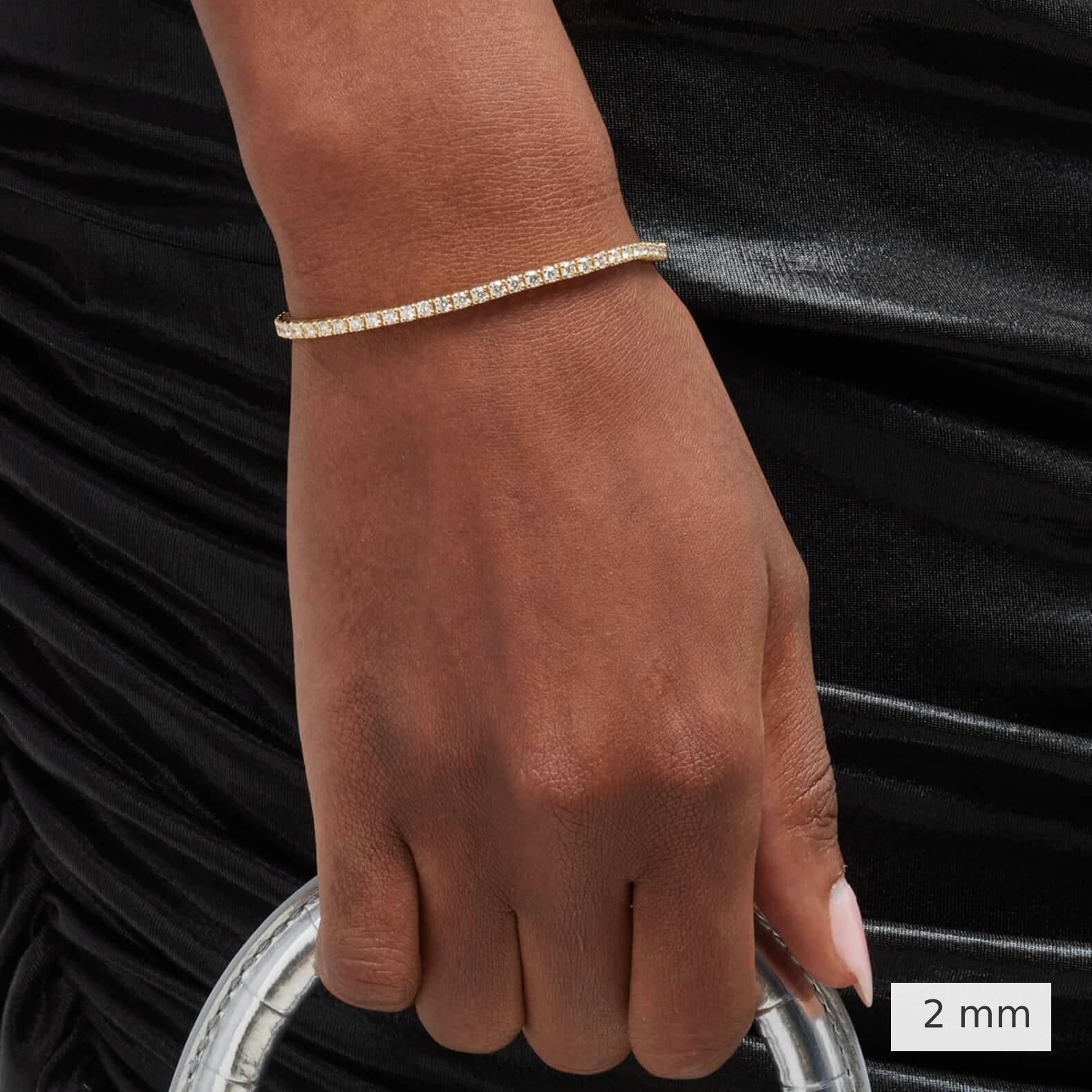 2 mm lab-grown diamond tennis bracelet worn on the wrist.