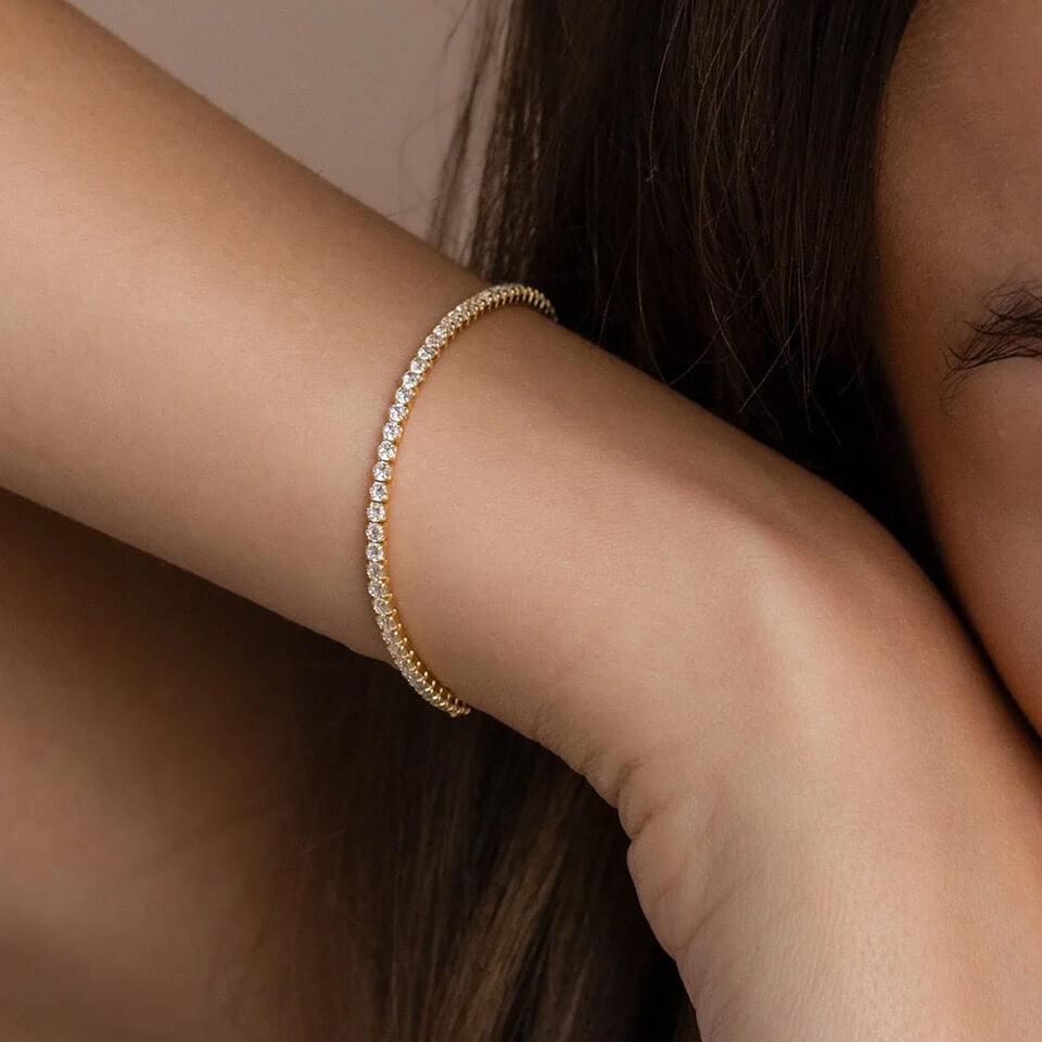 2 mm moissanite tennis bracelet worn on the wrist.