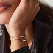 2 mm moissanite tennis bracelet worn on the wrist.