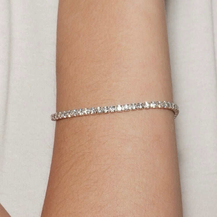 2 mm moissanite tennis bracelet worn on the wrist.