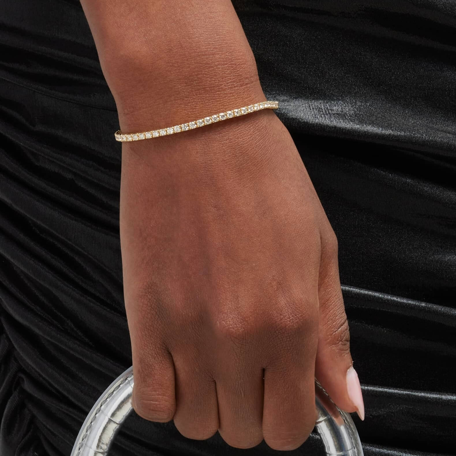 2 mm moissanite tennis bracelet worn on the wrist.