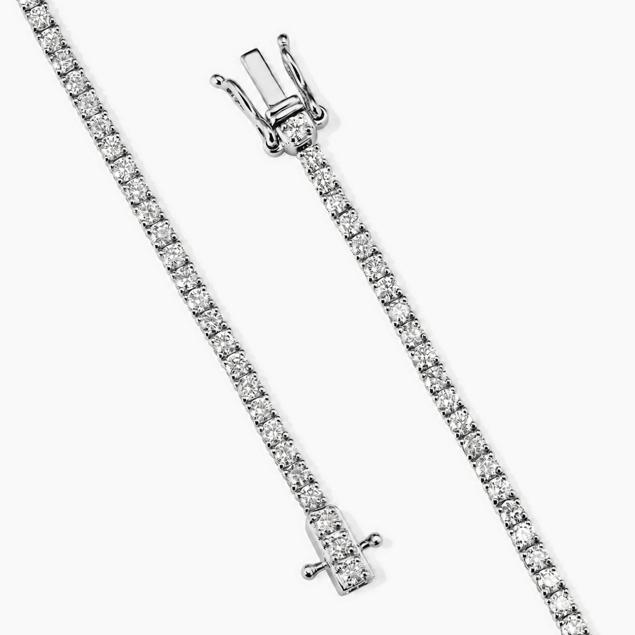 2 mm moissanite tennis bracelet in white gold vermeil, open clasp and safety catch detail.
