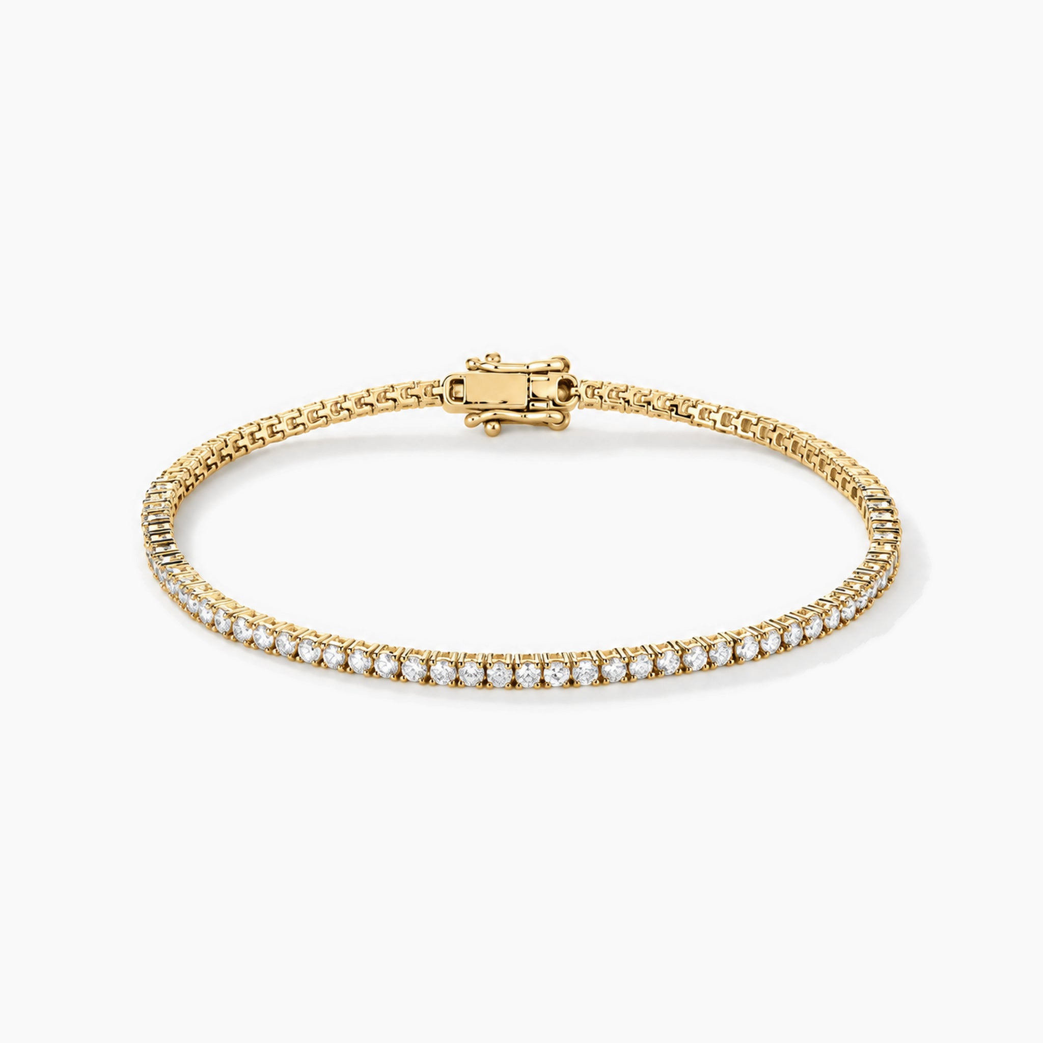 2 mm moissanite tennis bracelet in yellow gold vermeil, closed oval view.