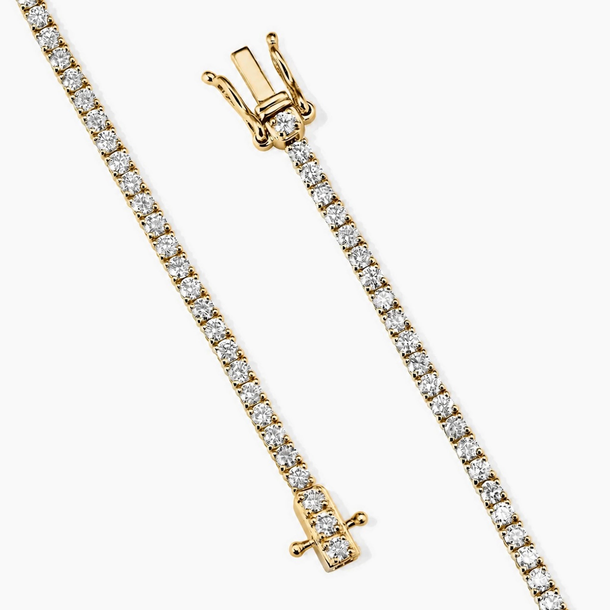 2 mm moissanite tennis bracelet in yellow gold vermeil, open clasp and safety catch detail.