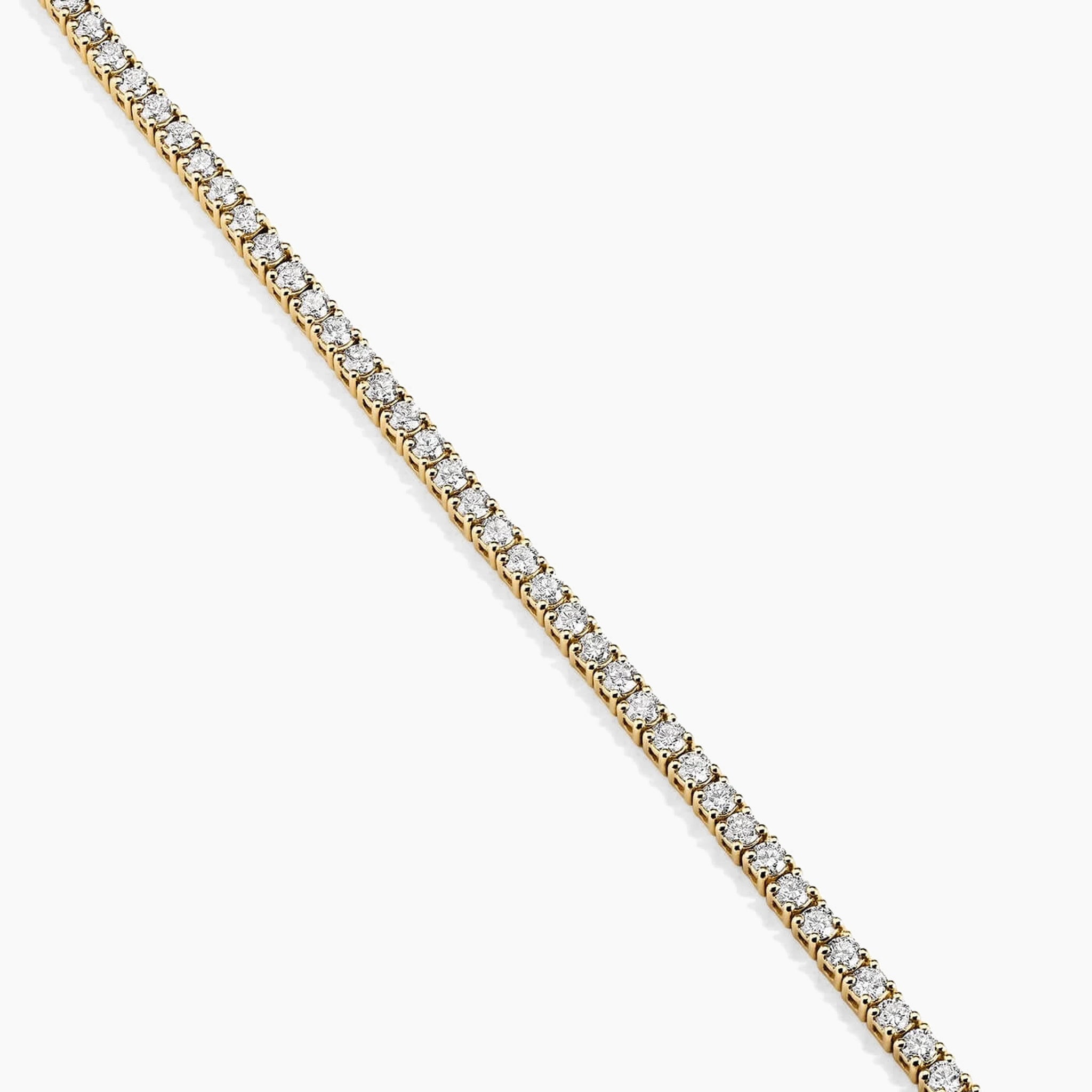 2 mm moissanite tennis necklace in yellow gold vermeil, close-up detail.