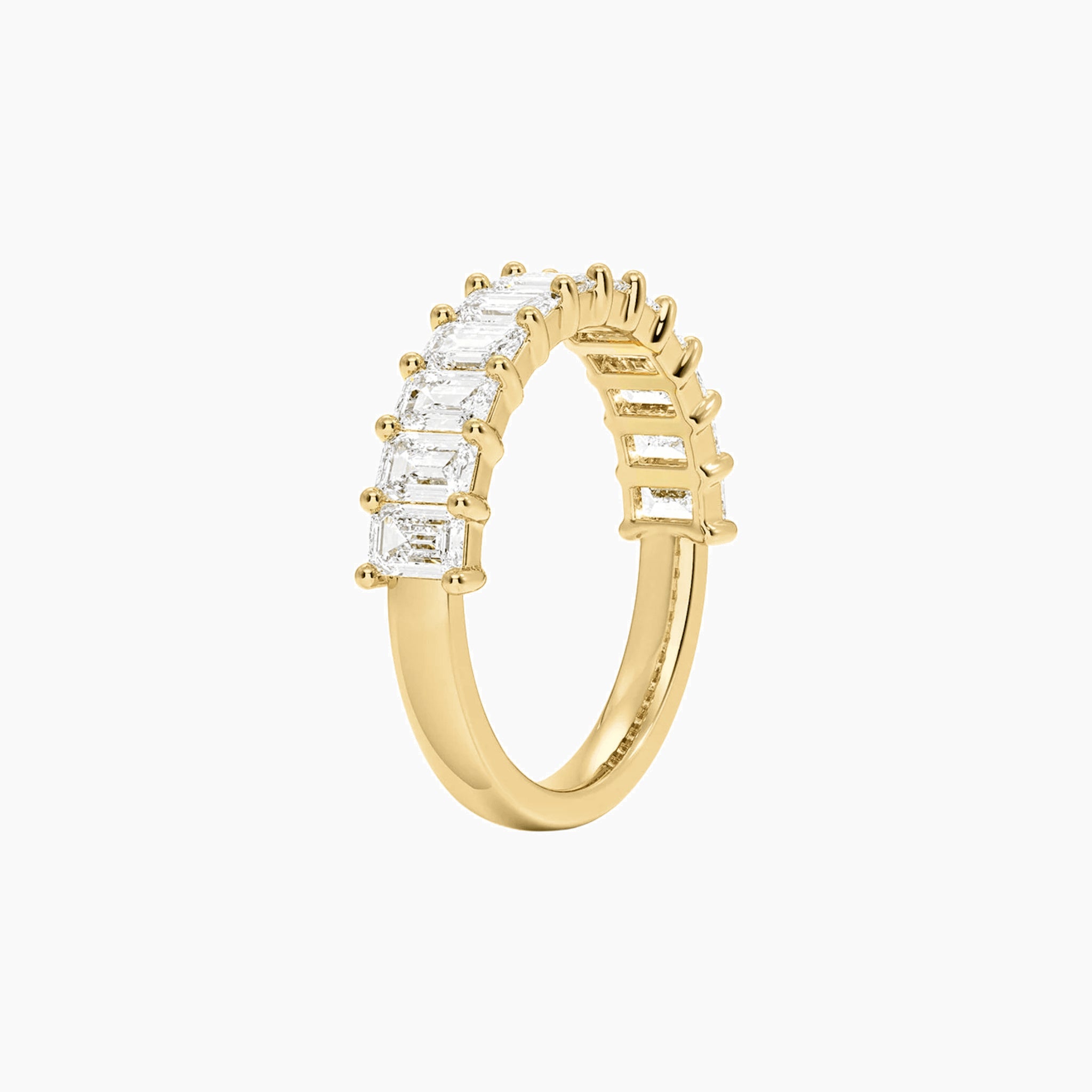 3 ct emerald-cut moissanite half eternity ring in yellow gold vermeil, side view.