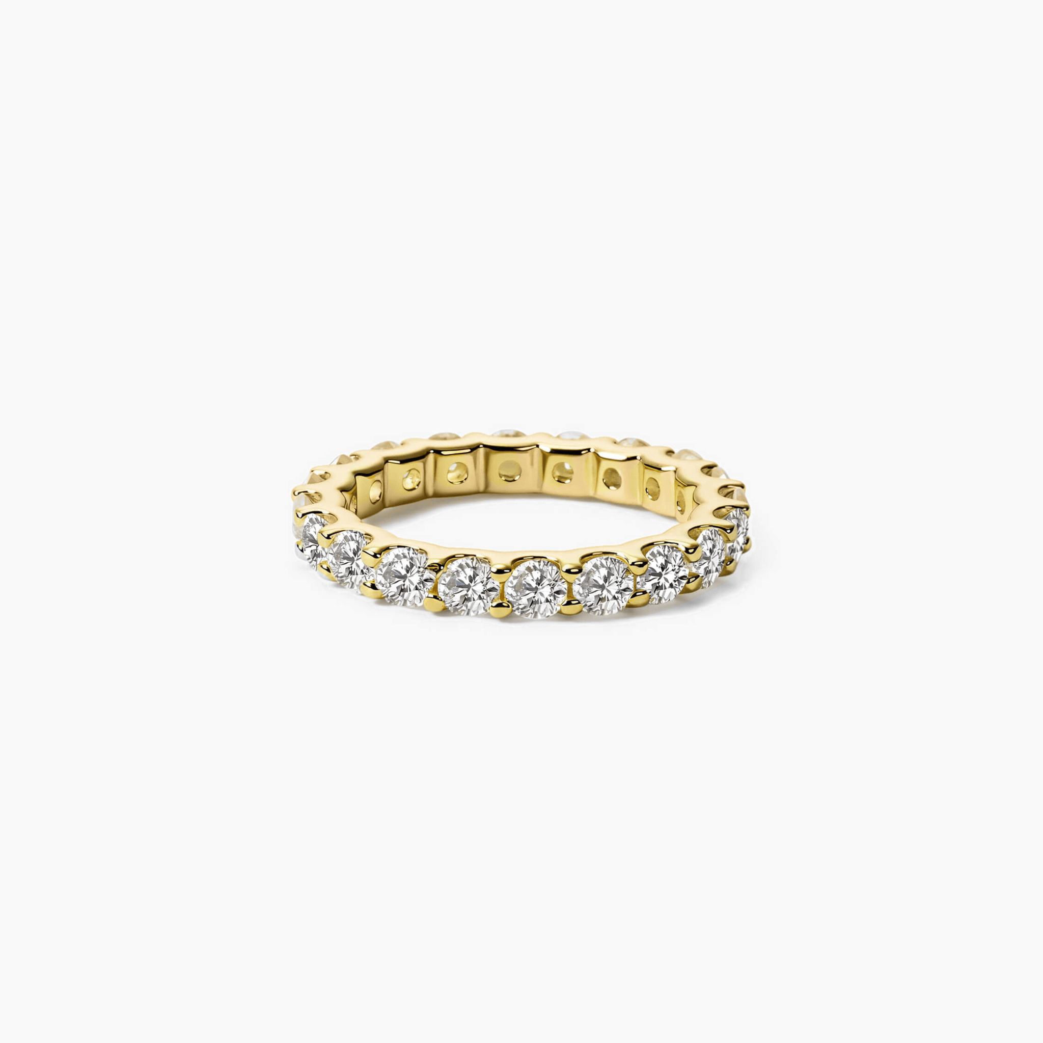 3 mm moissanite eternity ring in yellow gold vermeil, front view.