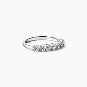 3 mm moissanite half eternity ring in white gold vermeil, angled view.