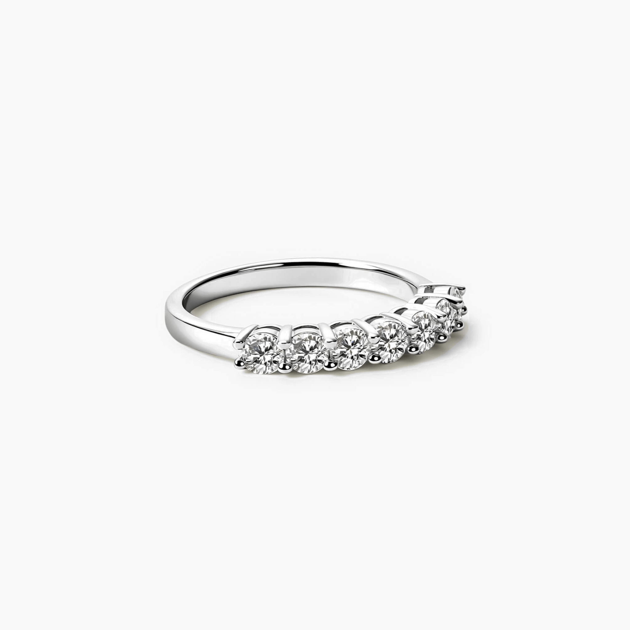 3 mm moissanite half eternity ring in white gold vermeil, angled view.