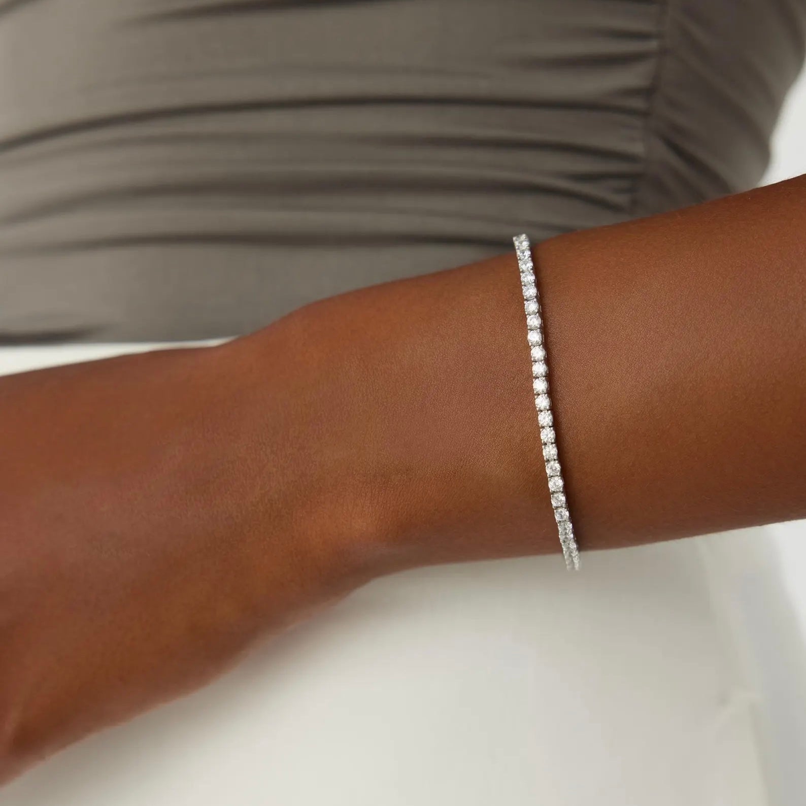 3 mm moissanite tennis bracelet worn on the wrist.