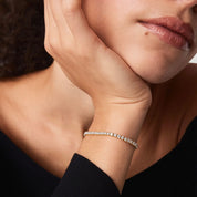 3 mm moissanite tennis bracelet worn on the wrist.