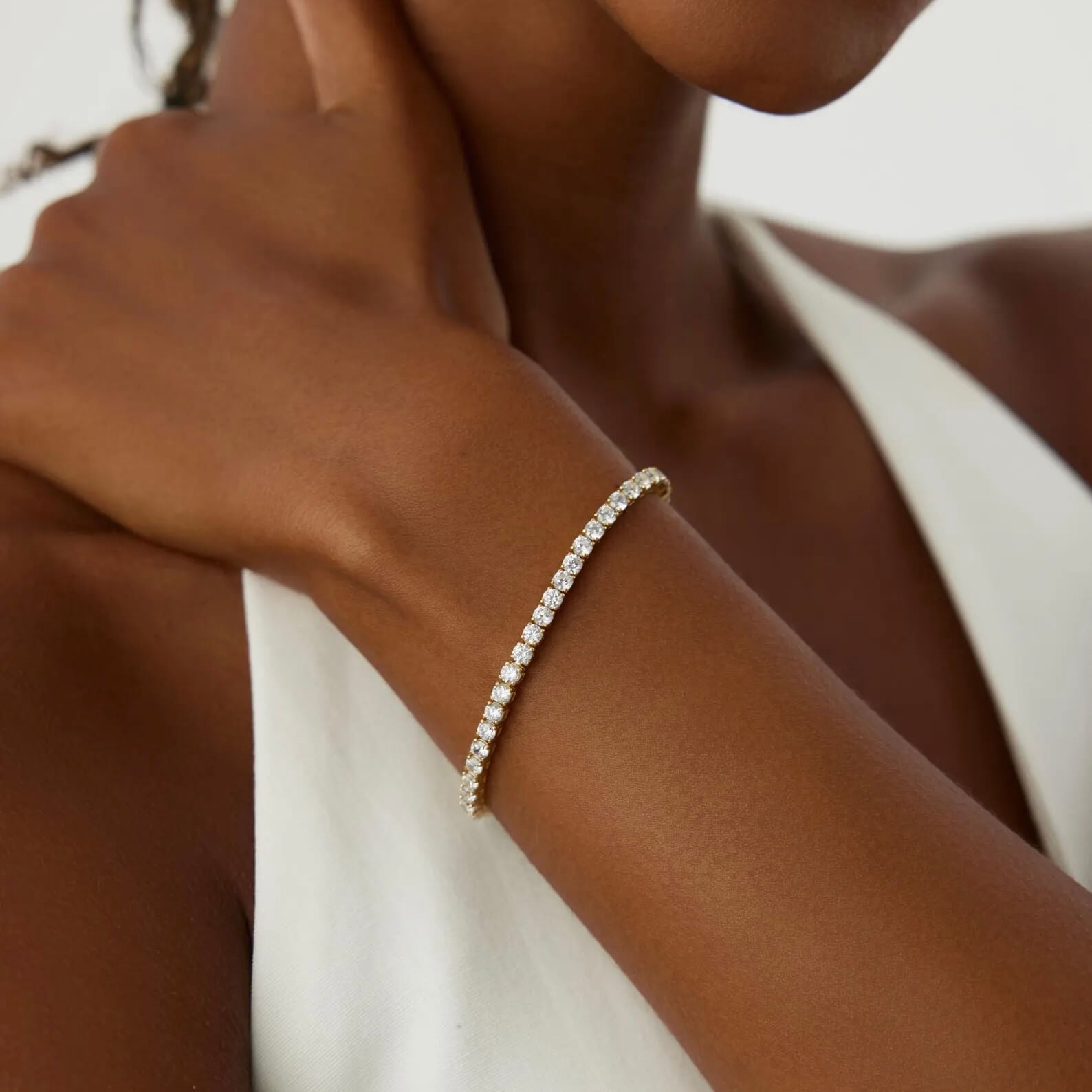3 mm moissanite tennis bracelet worn on the wrist.