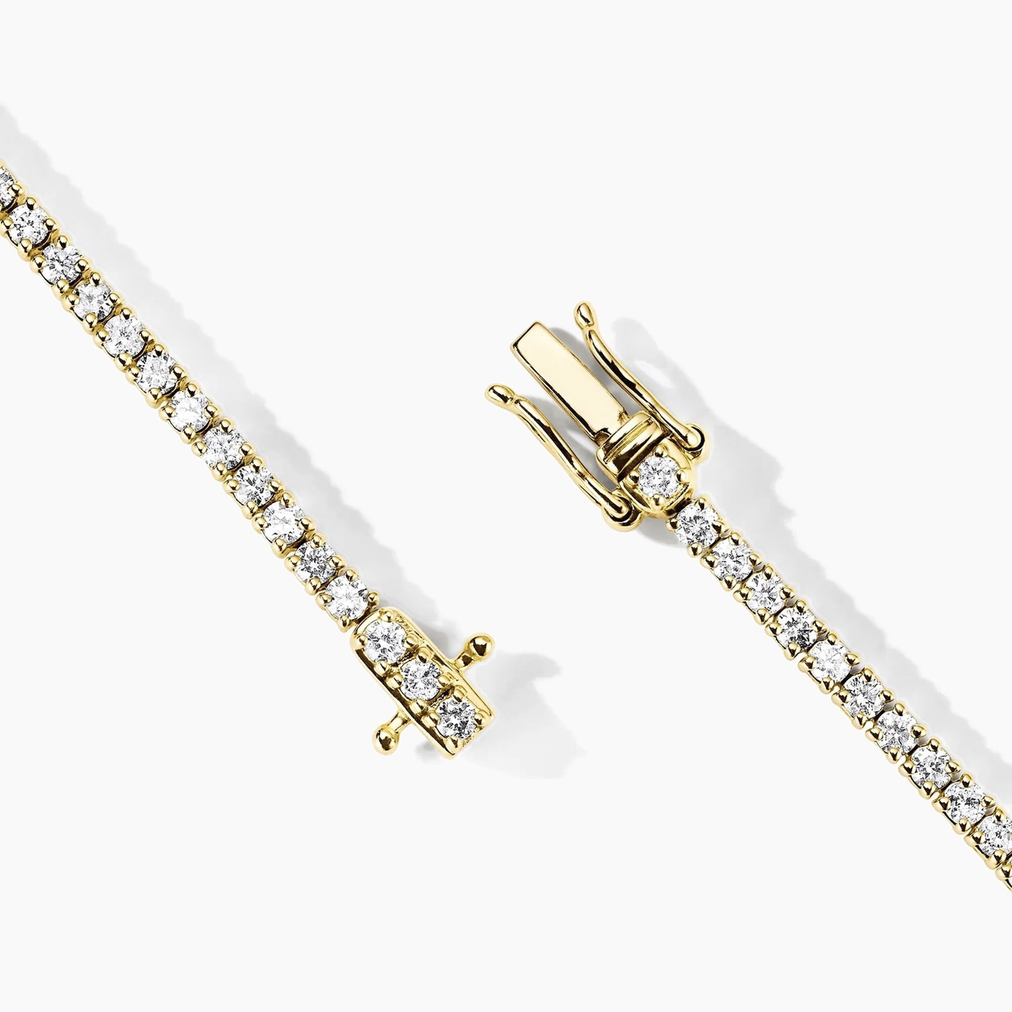 3 mm moissanite tennis necklace in yellow gold vermeil, clasp detail.