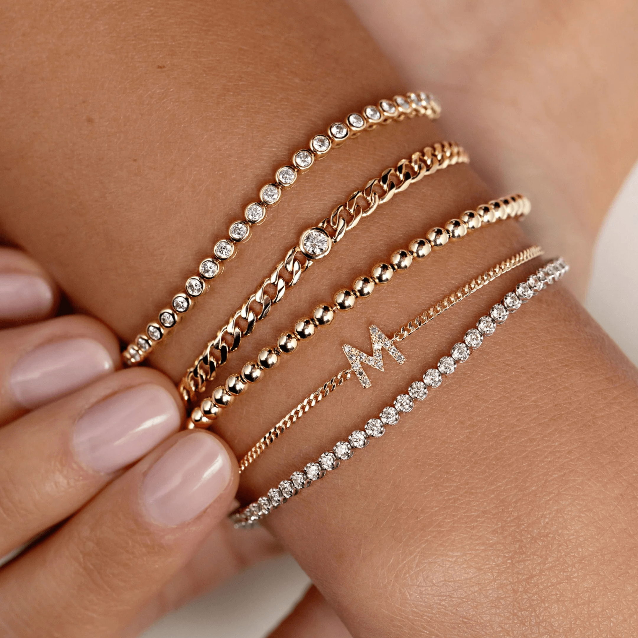 3 mm wide moissanite bezel tennis bracelet worn on the wrist.