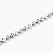 3 mm wide moissanite bezel tennis bracelet in white gold vermeil, close-up detail.
