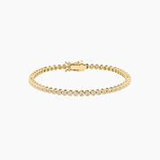 3 mm wide moissanite bezel tennis bracelet in yellow gold vermeil, closed view.