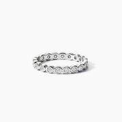 3 mm wide round-cut moissanite bezel eternity ring in white gold vermeil, front view.