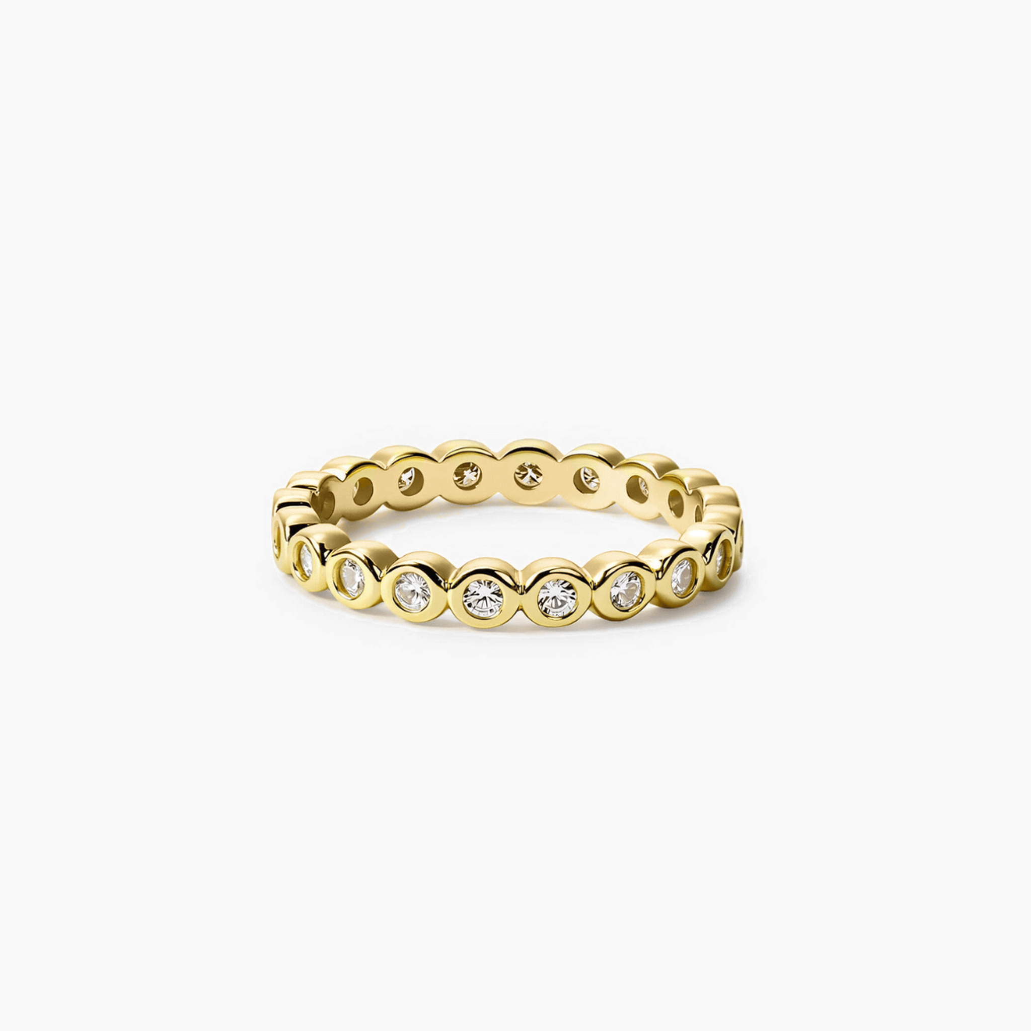 3 mm wide round-cut moissanite bezel eternity ring in yellow gold vermeil, front view.