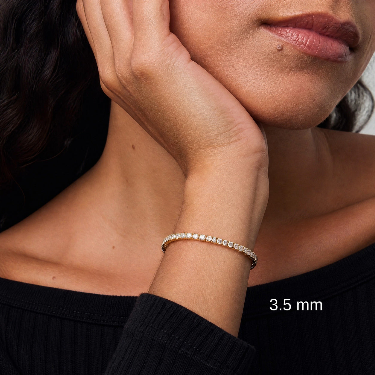 3.5 mm yellow gold vermeil moissanite tennis bracelet on model in black, white size label.
