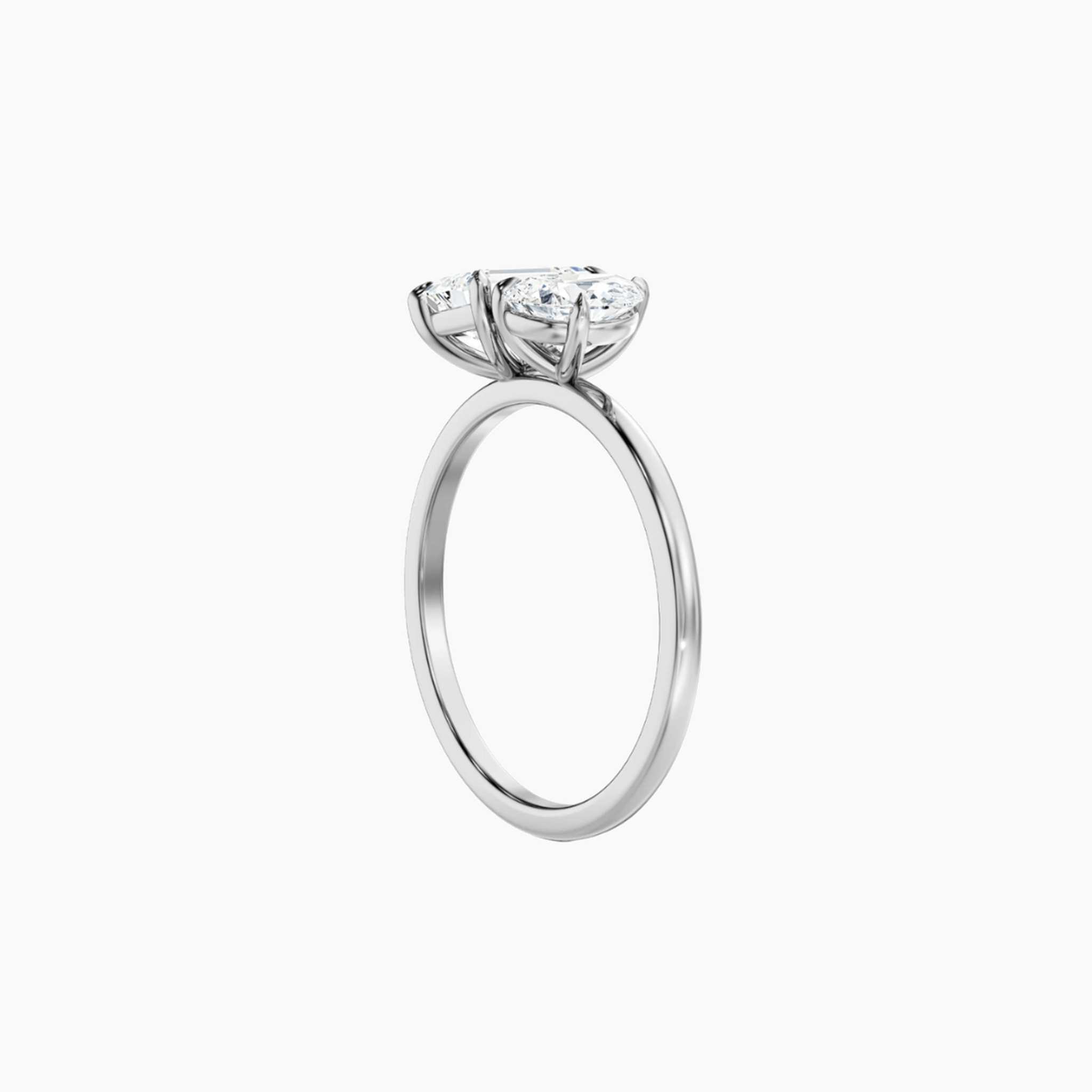 4 ct pear-cut and emerald-cut moissanite toi et moi ring in white gold vermeil, side view.