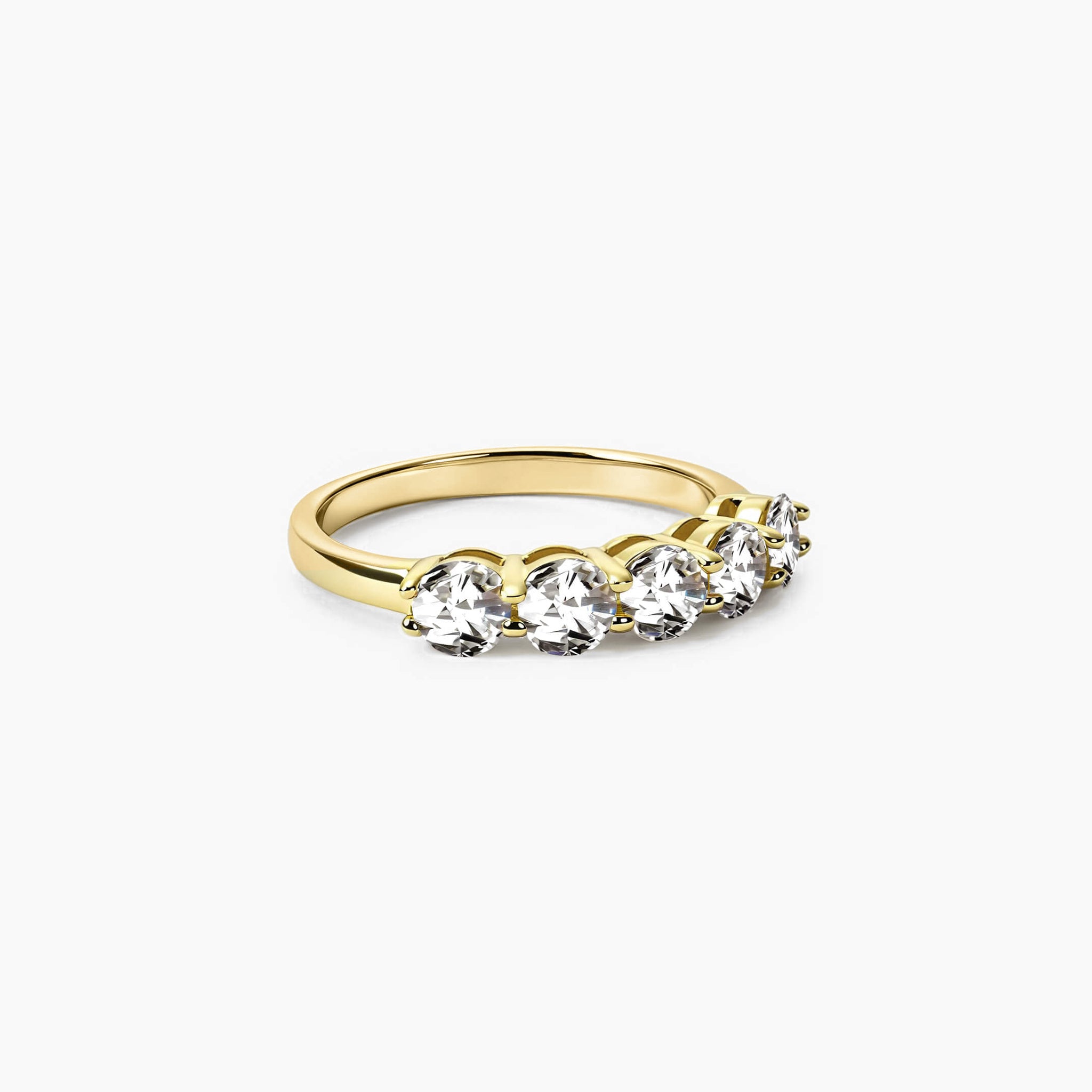4 mm moissanite half eternity ring in yellow gold vermeil, angled view.