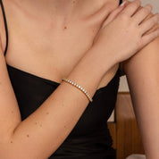 4 mm moissanite tennis bracelet worn on the wrist.