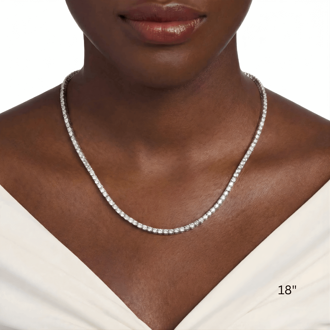4 mm moissanite tennis necklace worn at the neckline.