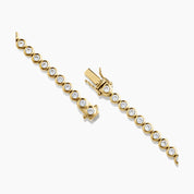 4 mm wide moissanite bezel tennis bracelet in yellow gold vermeil, clasp detail.