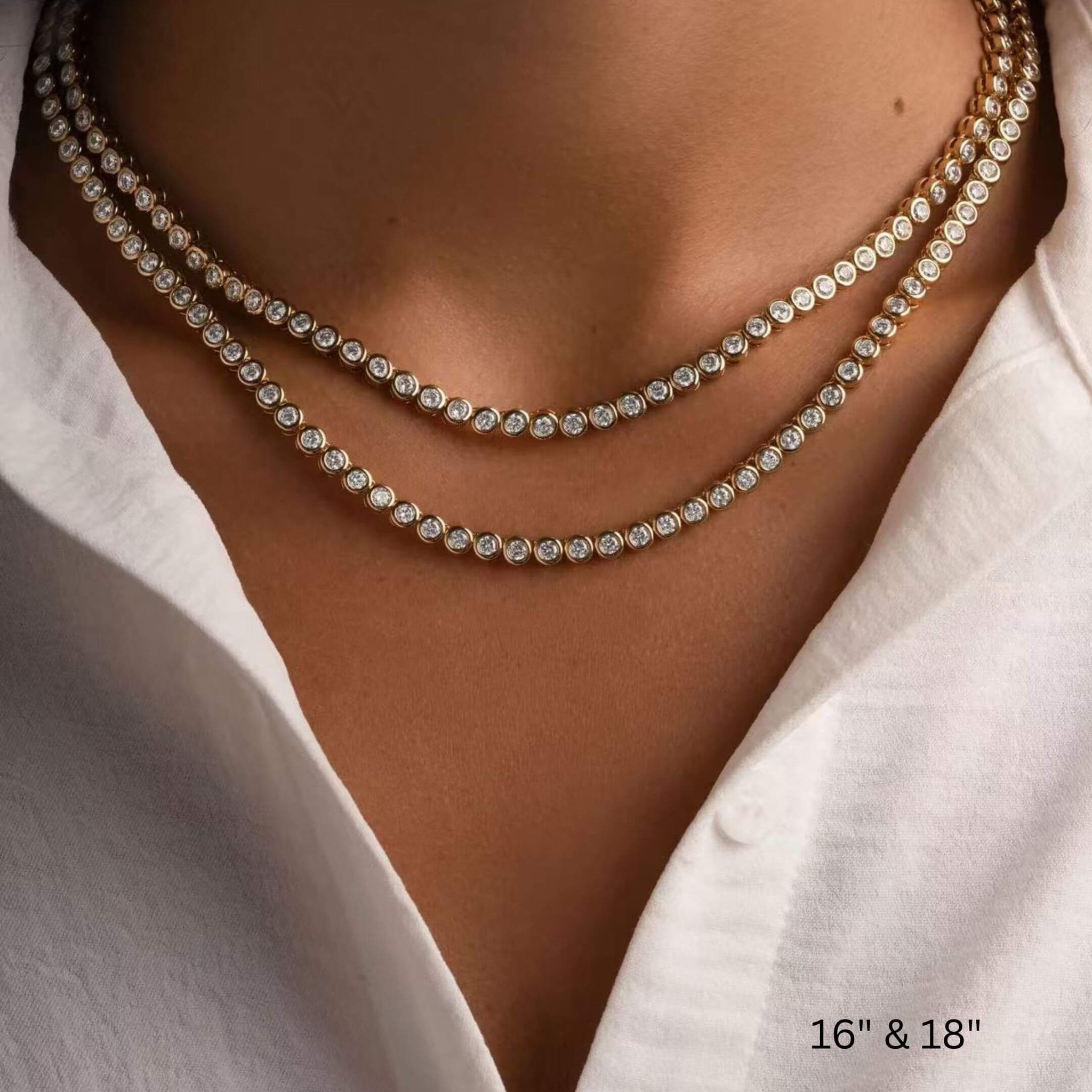 4 mm wide moissanite bezel tennis necklace 16-inch and 18-inch necklaces shown together on the neckline.