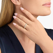 4 mm wide round-cut moissanite bezel eternity ring worn on a finger.