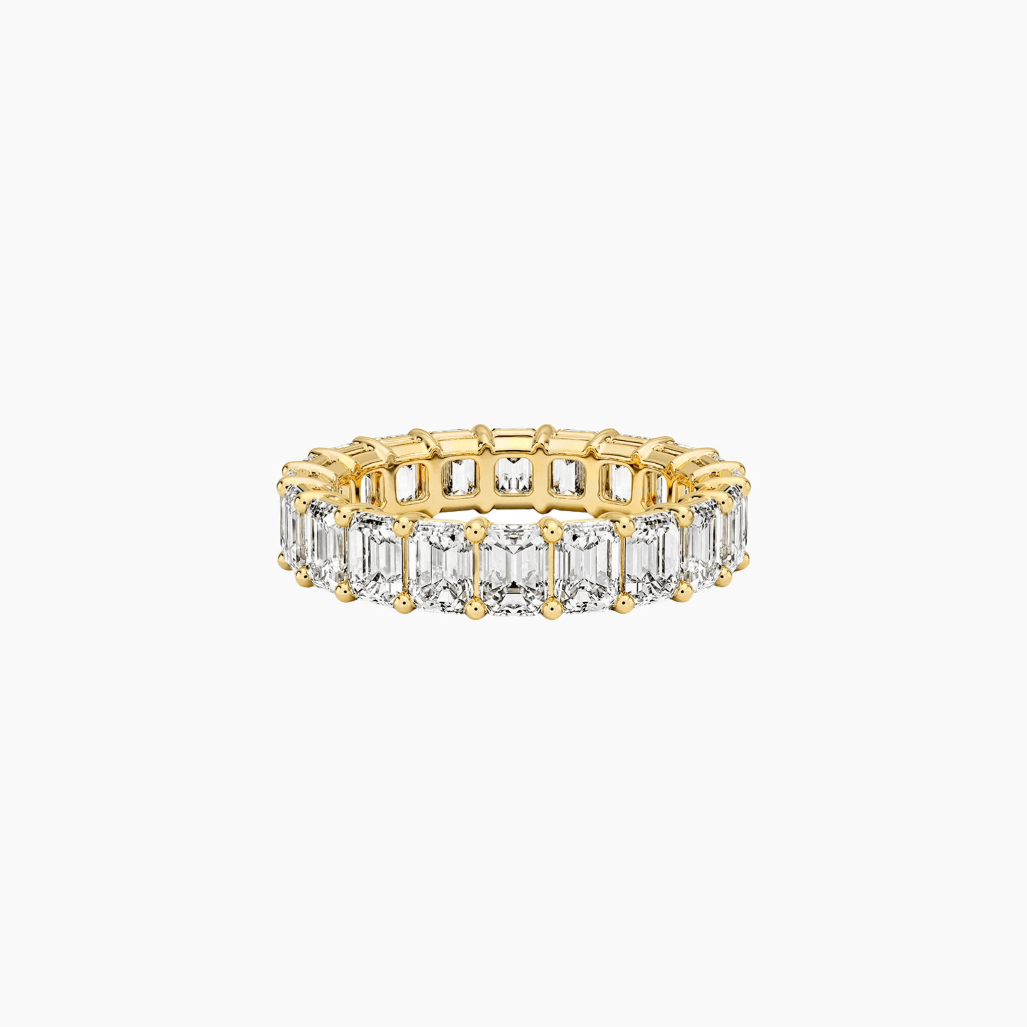 6 ct emerald-cut moissanite eternity ring in yellow gold vermeil, front view.