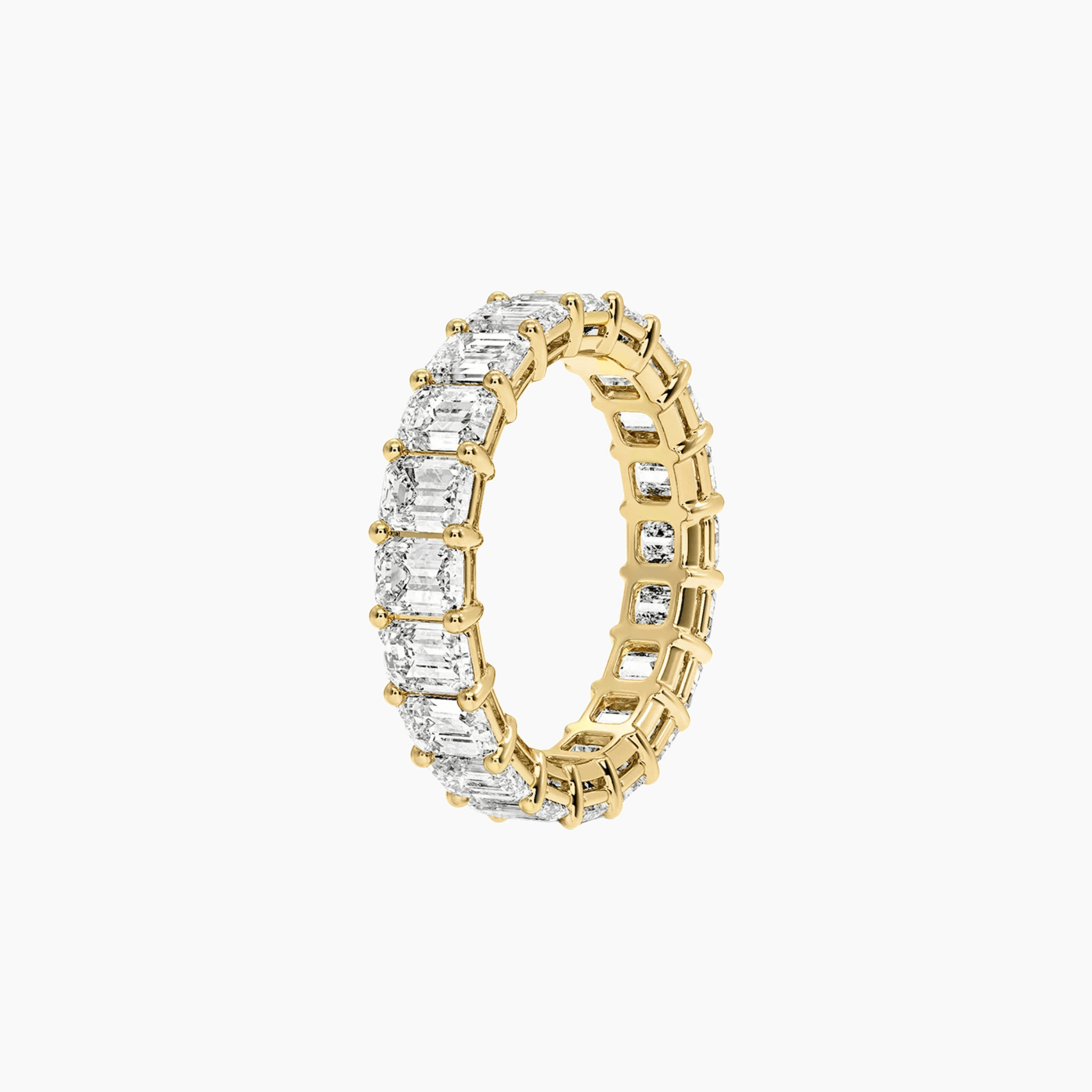 6 ct emerald-cut moissanite eternity ring in yellow gold vermeil, side view.