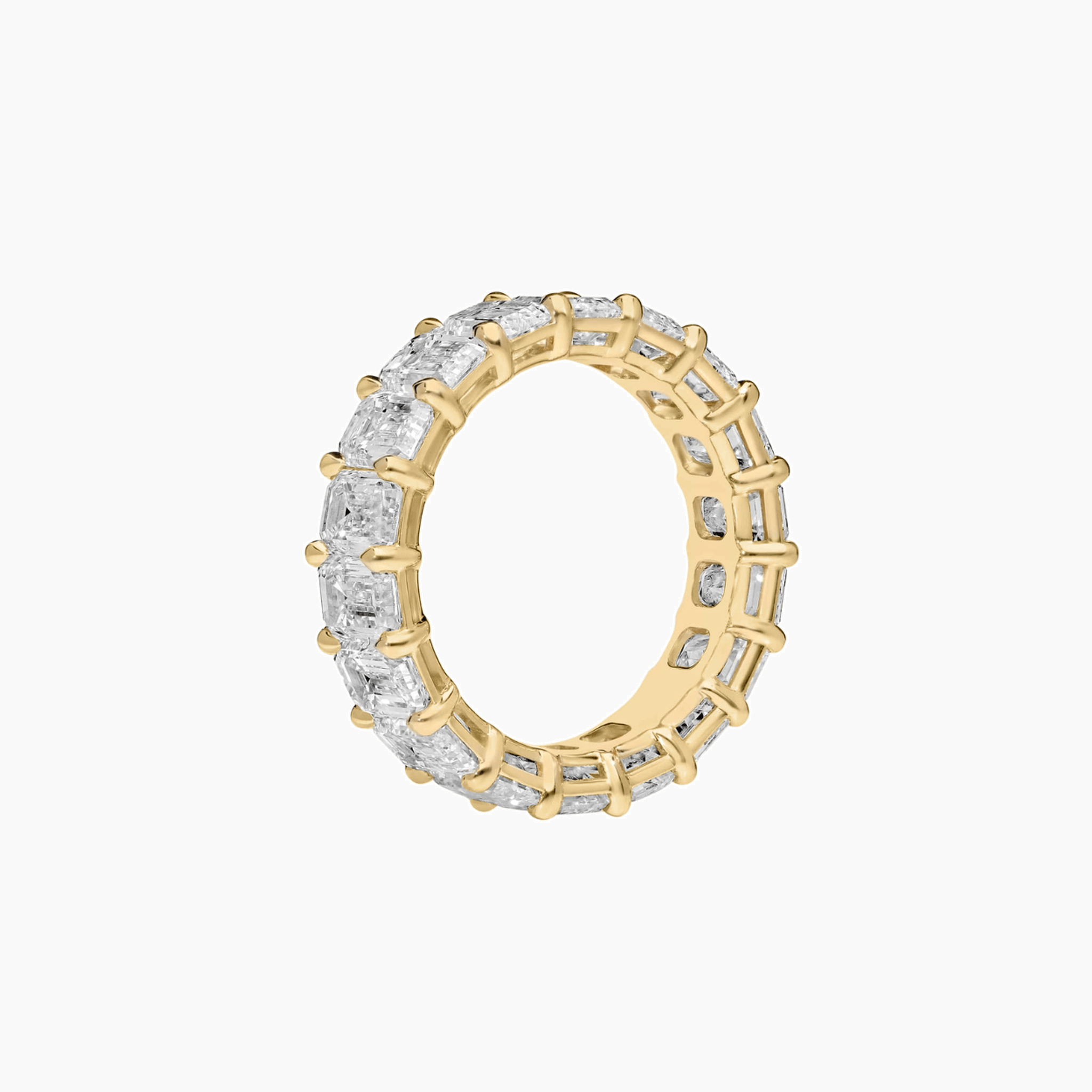 9 ct emerald-cut moissanite eternity ring in yellow gold vermeil, side view.