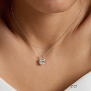 Asscher-cut moissanite bezel pendant necklace worn at the neckline.